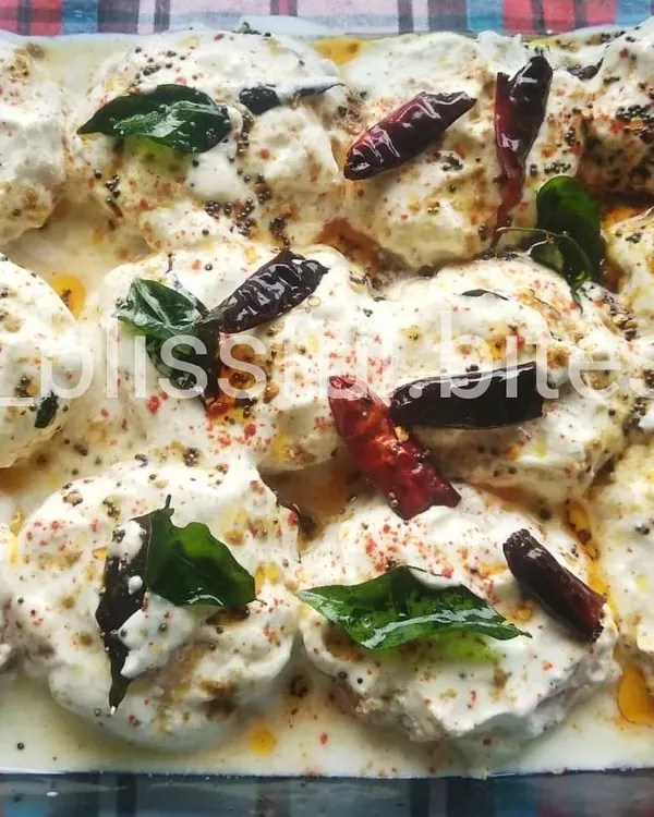 My homemade Dahi Vada, where soft vadas are drenched in thick, seasoned yogurt and garnished with spices and herbs.