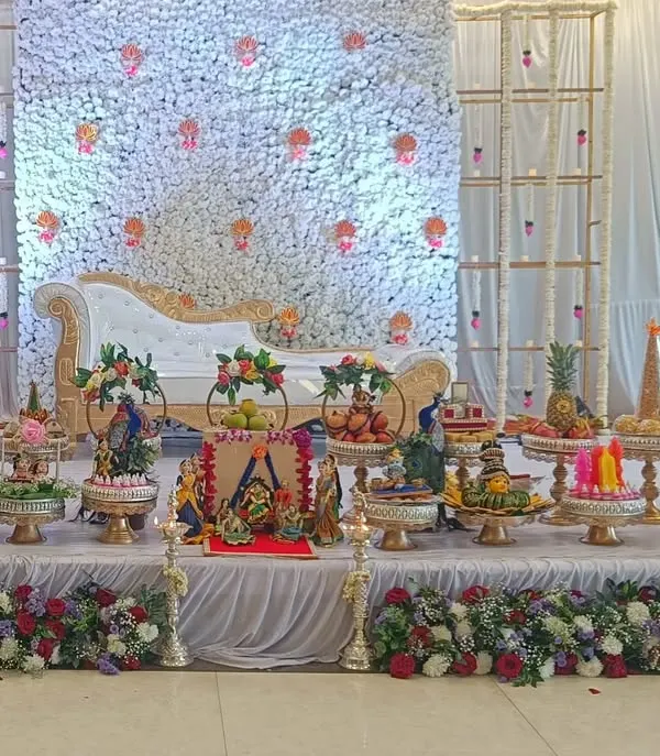 Your gift display should complement your event's decor perfectly. Here is a full stage setup where my decorated platters of fruits, sweets, and themed dolls are arranged to create a complete, beautiful, and cohesive look for the ceremony.