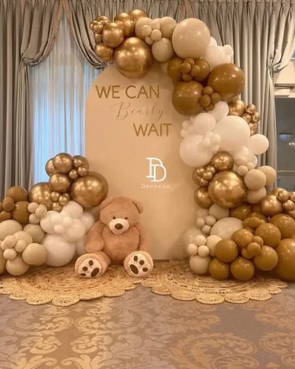 A full view of my elegant teddy bear baby shower setup. The neutral tones of beige, white, and gold create a timeless feel, and the large plush teddy bear makes for a sweet and cuddly centerpiece.