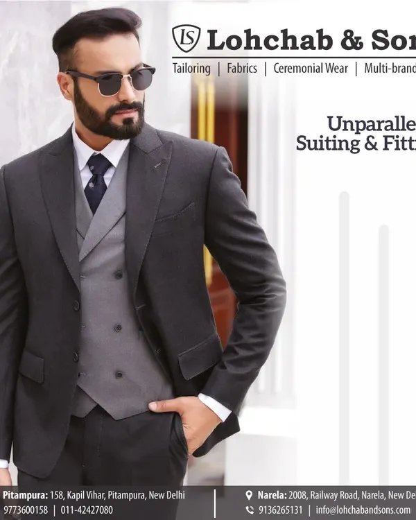 A sharp, charcoal grey three-piece suit that showcases our promise of unparalleled suiting and fitting. Notice the clean lines of the jacket and the perfect drape of the trousers, a testament to our bespoke tailoring process.