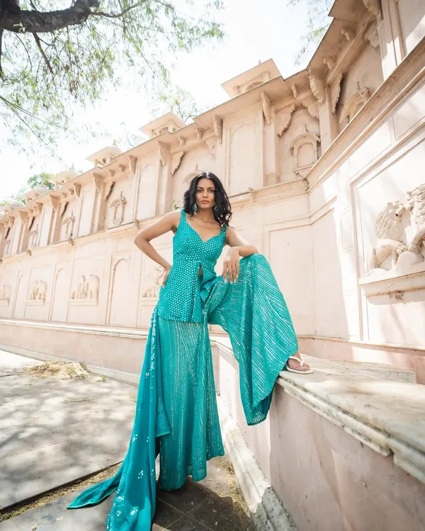 This is for when you need to make an entrance. This turquoise sharara set with intricate mirror work is perfect for a sangeet or mehendi. It’s modern, comfortable, and you don’t have to worry about dry cleaning it after the party. I get it, you want to look amazing without the hassle.