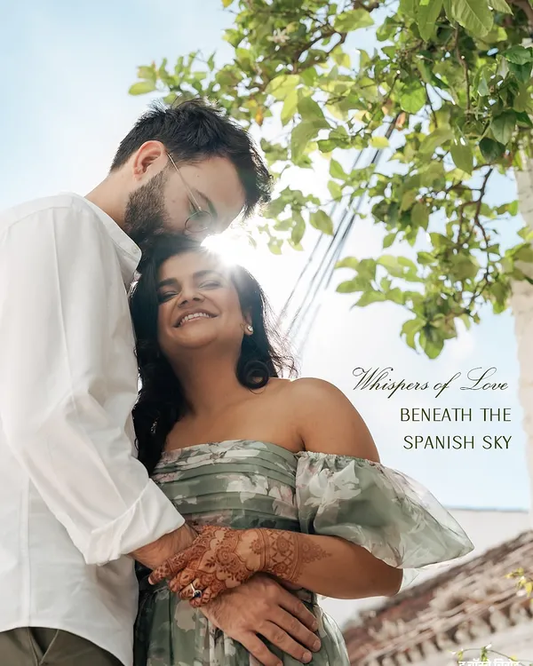 A quiet moment captured beneath the Spanish sky. For us, styling a pre-wedding shoot is about creating a feeling, not just an image. It's in the choice of a flowing floral dress that moves with the breeze and a classic white shirt for him, creating a look that is both effortless and unforgettable.