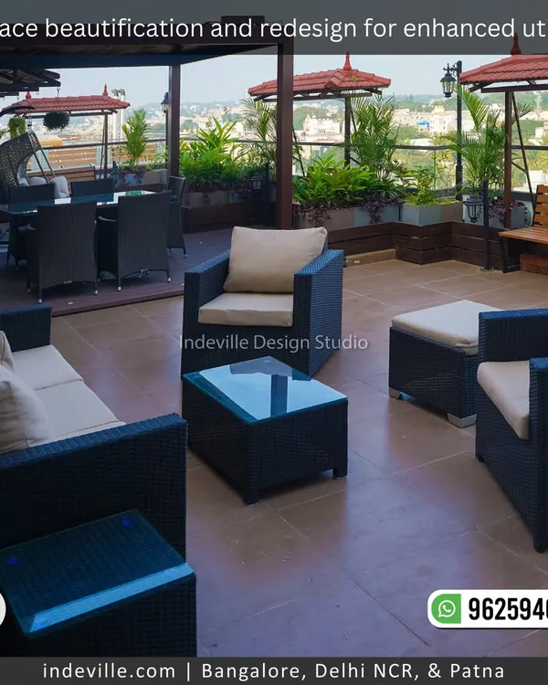 This redesigned terrace is all about enhanced utility and comfort. I've zoned the space with weatherproof wicker lounge furniture, a shaded swing bench, and lush planters to create the perfect outdoor escape for relaxation and socializing.