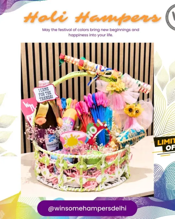 A fun and festive Holi hamper overflowing with goodies. This basket includes a bottle of thandai, water guns, organic colors, and snacks, all decorated with a playful "I came for the Thandai" tag.