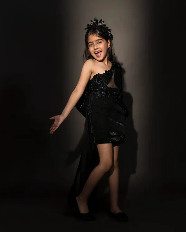 Steal the spotlight in this luxurious one shoulder black dress, embellished with sequins and featuring a dramatic side tail.