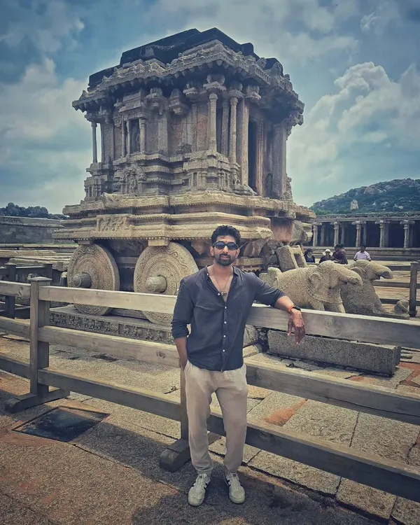 Standing next to the world-famous Stone Chariot at the Vittala Temple complex in Hampi. It's a masterpiece of ancient Indian architecture.