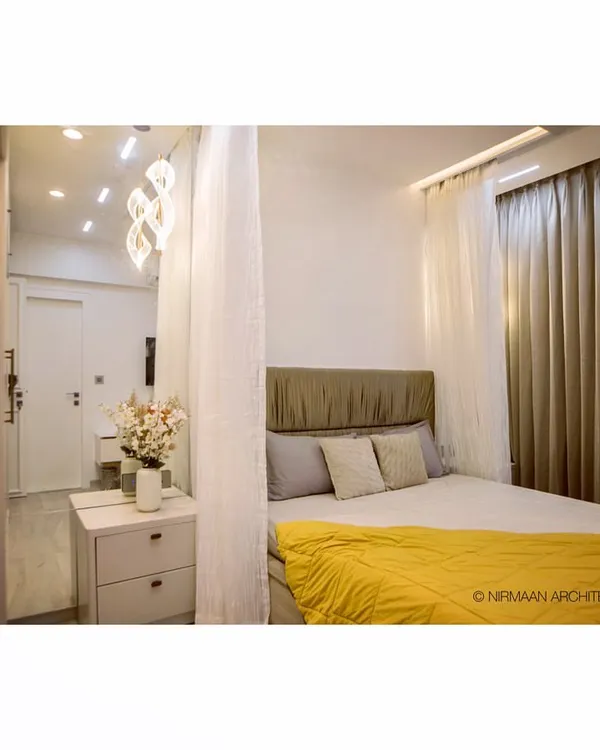 This daughter's bedroom in our Bhagwati Greens project is both smart and stylish. The canopy bed adds a touch of whimsy, while the automated lighting can be controlled for study, play, or sleep.