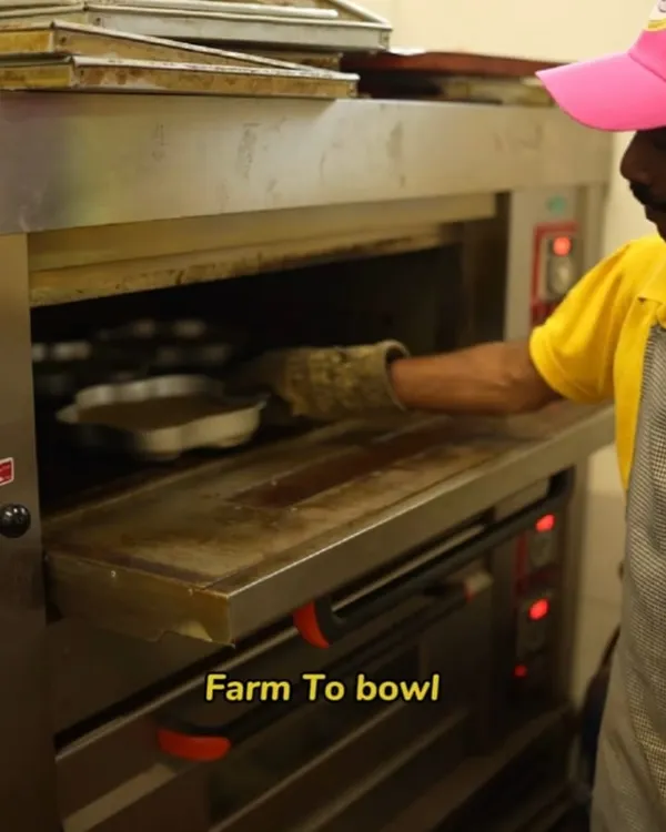 From the farm to their bowl, I am committed to freshness. Here, a fresh cake base made with human-grade ingredients is going into the oven.