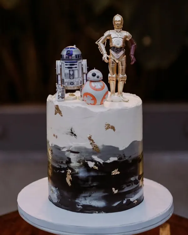 A unique, personalized wedding cake featuring Star Wars characters R2-D2, C-3PO, and BB-8. I love incorporating fun and personal details that tell your unique story as a couple.