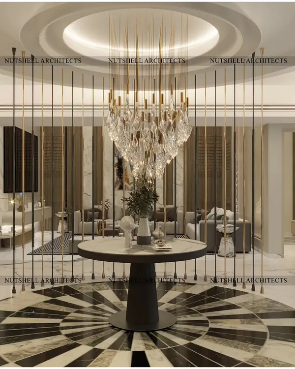 We believe a home's first impression should be unforgettable. This entrance foyer makes a grand statement with its dramatic stone inlay flooring, a custom sculptural partition, and a magnificent crystal chandelier, creating the opulent feel of a luxury hotel lobby right at your doorstep.