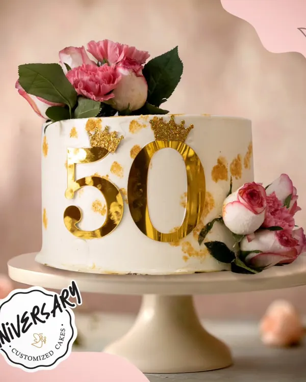 This gorgeous cake celebrates a love that's truly golden. We designed this elegant 50th-anniversary cake with striking gold accents and fresh pink roses for a couple in Greater Kailash, marking their incredible milestone in style.
