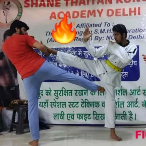 This is what I teach. Not just theory, but real, practical combat. Here, my student executes a powerful kick during a partner drill, showing both precision and control. This is freestyle martial arts in action.
