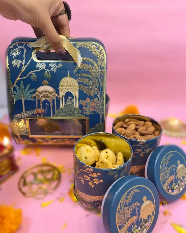 My elegant '2 Jar Box' for Diwali, featuring premium almonds and my savory Chilli Cheese Cookies. The beautiful blue and gold tin makes for a royal gift.