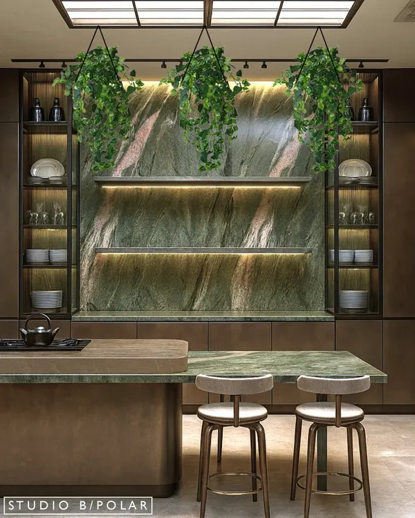 This kitchen design is centered around a stunning green stone backsplash, which is beautifully illuminated by under-shelf lighting. Hanging plants and a stretch ceiling that mimics natural light make the space feel fresh and vibrant.
