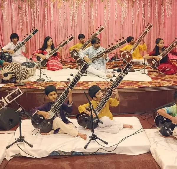 This is the moment all the practice leads to. My students, some as young as eight, are seen here performing at our annual Gurupoornima concert, accompanied by professional tabla players. This event is a core part of my teaching, providing a platform for every student to build confidence and experience the joy of a live recital.