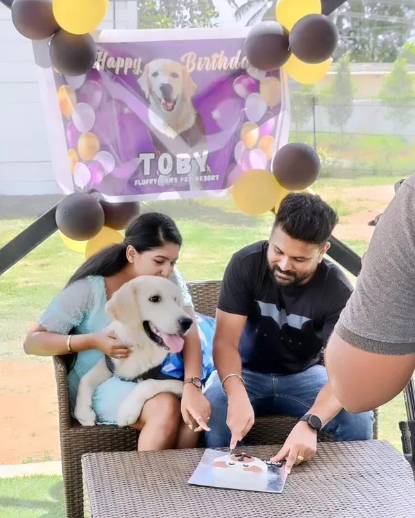 Hugs, kisses, and plenty of birthday wishes for Toby. We set up this cozy spot for his family to celebrate and cut the special dog-friendly birthday cake.