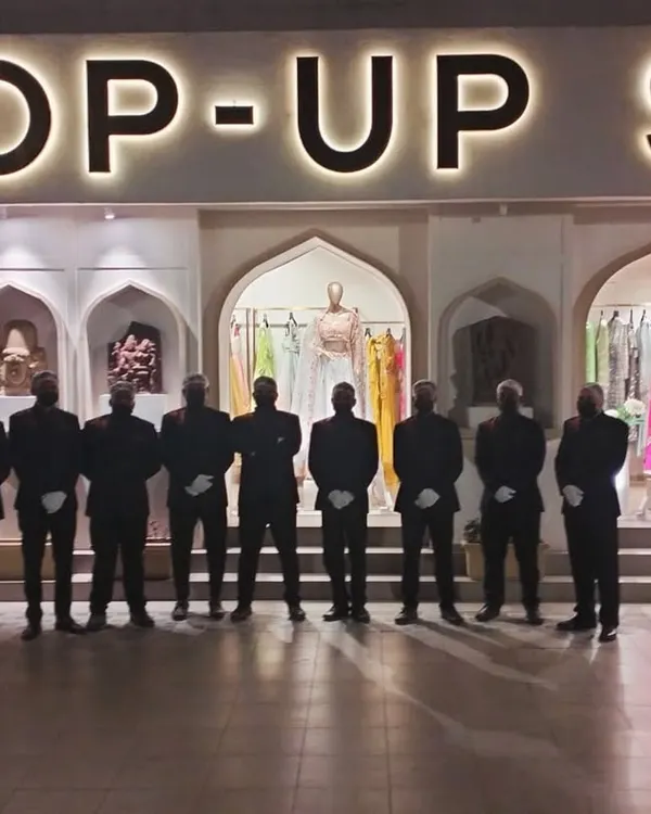 Our team stands ready for an event with Pernia's Pop-Up Shop. We pride ourselves on our team's professionalism and coordinated service, ensuring a smooth experience for our high-profile clients.