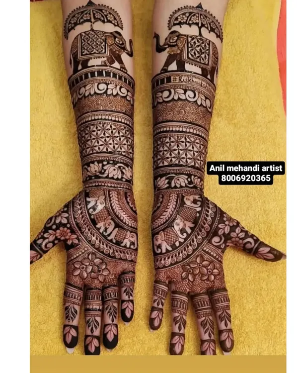 The royal baraat comes alive in this design, featuring majestic elephants carrying umbrellas (chhatris). This is a classic and grand theme for bridal mehendi, symbolizing a royal procession.