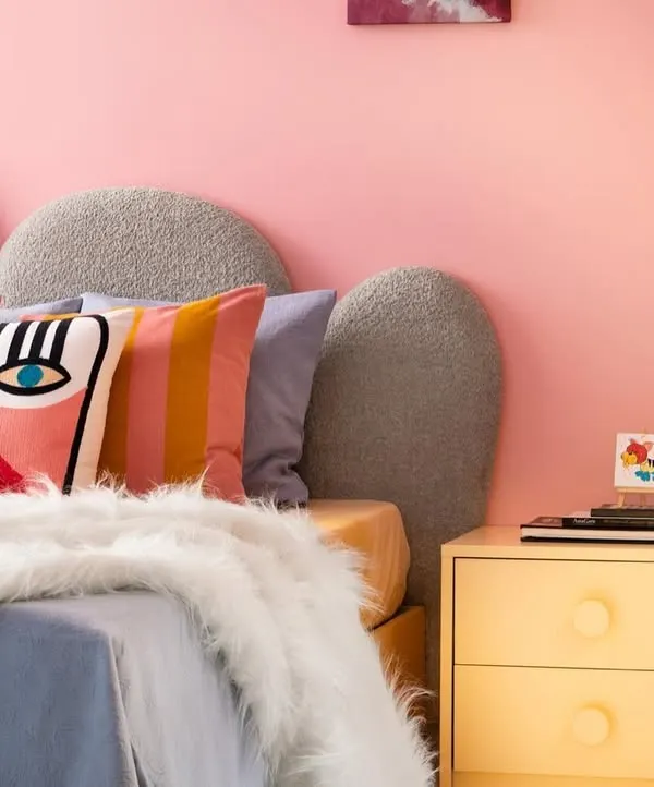 Welcome to imagination’s playground. In this room, I used a kaleidoscope of colors, a pebble-shaped headboard, and playful textures to create a space where dreams take flight and creativity knows no bounds.