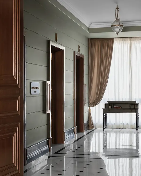 First impressions begin the moment the lift doors open. For the Maddock office, I designed this grand lift lobby with soft sage green walls, custom black and white flooring, and a dramatic 12 foot wooden door to create a cinematic and elegant prelude to the creative world within.