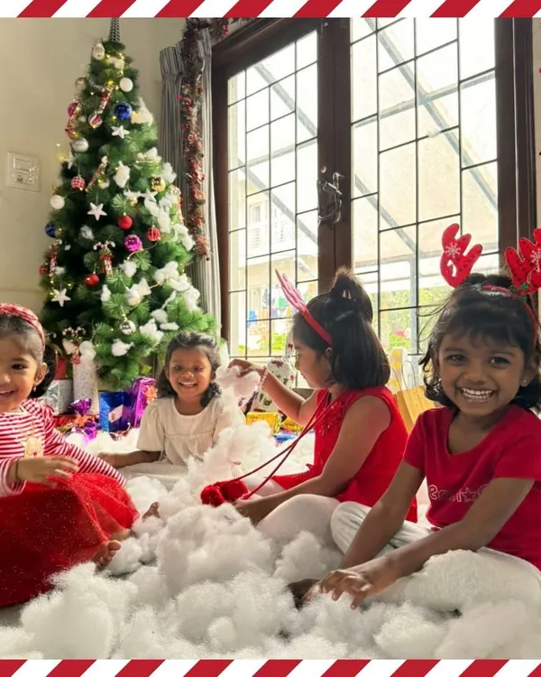 The pure joy of Christmas. Our students revel in a winter wonderland scene, complete with a festive tree and fluffy "snow," creating magical memories together.
