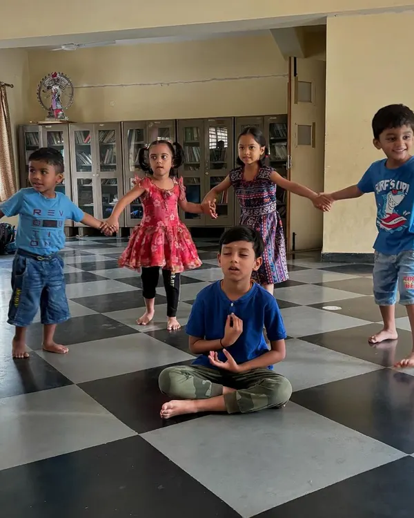A moment of quiet reflection during a group activity at our Ramana Summer Camp. We guide children to find their centre, blending mindfulness with playful exercises to build focus and inner calm, a practice central to the path of self-enquiry.