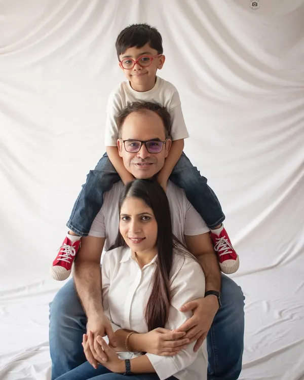 The classic family "totem pole" pose. It's always a fun and playful way to get a great family portrait with everyone close together.