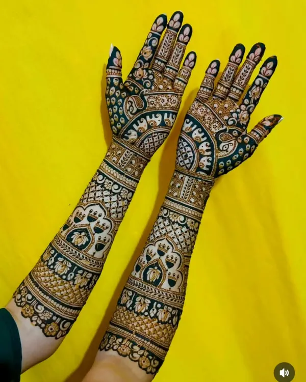This design showcases a stunning contrast effect, where filled-in spaces make the intricate patterns pop. It features rows of elephants and elegant architectural arches for a unique look.
