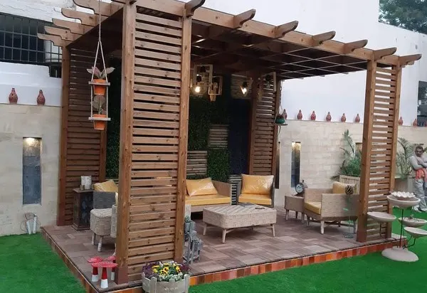 I designed this outdoor living area to be a true extension of the home. The custom wooden pergola provides structure and shade, while the integrated seating and layered lighting create a warm, inviting atmosphere for relaxing or entertaining, day or night.