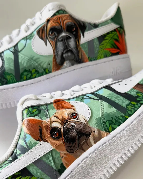 A close-up of the custom pet portraits on the Nike Air Force 1s. This shoe features a beautifully detailed painting of a French bulldog, capturing its curious and playful expression.