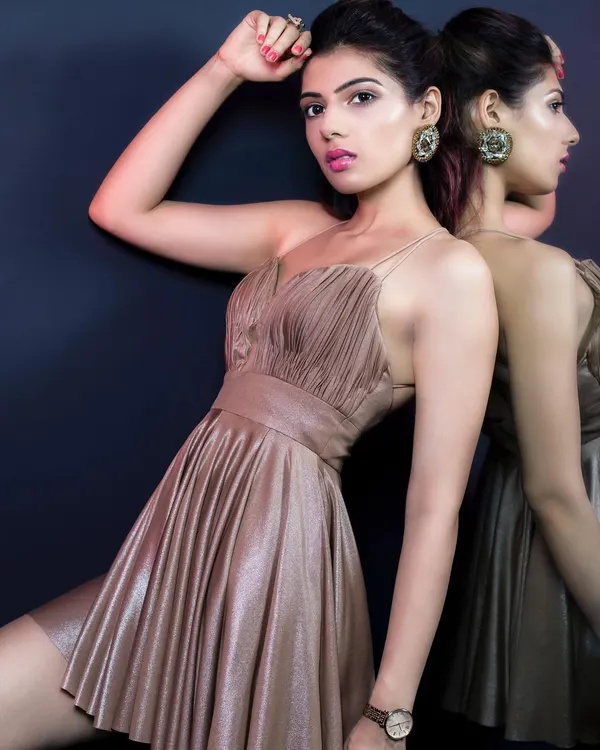 A brand shoot for Elviraa Official, featuring a golden ruched mini dress. I styled this look to feel luxurious and confident, perfect for an evening party. The mirror shot adds a dynamic and reflective element.