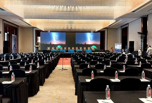 This large conference hall, set up for a major corporate summit, shows my capability in managing large-scale events. I handle everything from the seating arrangement for hundreds of guests to the complex multi-screen stage and AV setup.