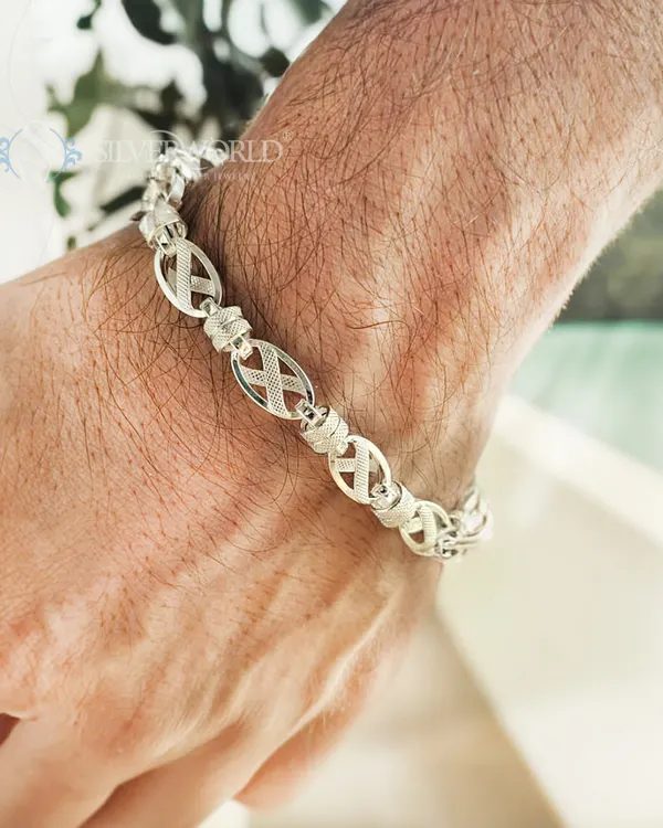 Our X-Link textured bracelet is designed for the modern man. This lifestyle shot shows how the unique sterling silver links sit comfortably on the wrist, making a statement of confidence.