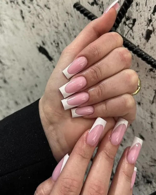 The perfect classic French manicure on long, square-shaped acrylic extensions. Clean, crisp, and always in style.
