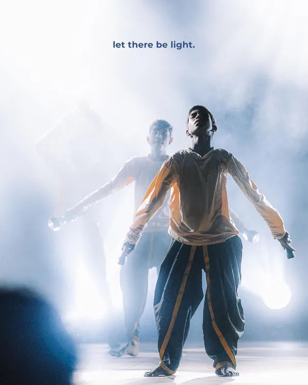A dancer commands the stage, bathed in ethereal light from flashlights. This shot captures the creative, high-energy moments I love to find at live performances, turning a fleeting second into a cinematic still.