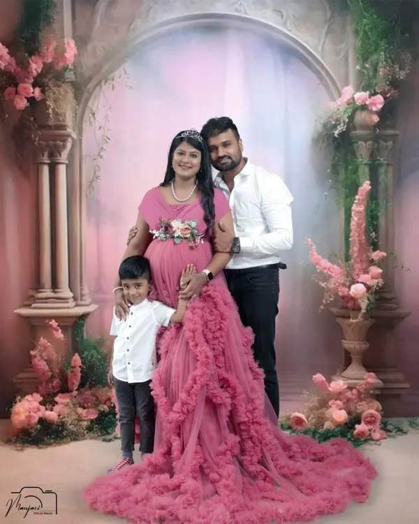 A beautiful family portrait. This couple includes their young son in their maternity shoot, capturing the excitement of him becoming a big brother.