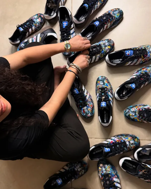 Surrounded by the finished product of a bulk order for a private client. This project involved hand-painting nine pairs of Adidas Sambas, each with a unique but cohesive splatter art design.
