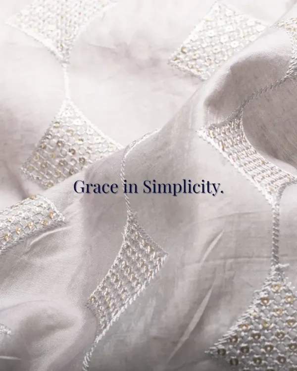 Grace in Simplicity. This image showcases the delicate, geometric sequin work on a fine white fabric, a tribute to tradition and a statement of style made for the modern Indian man.