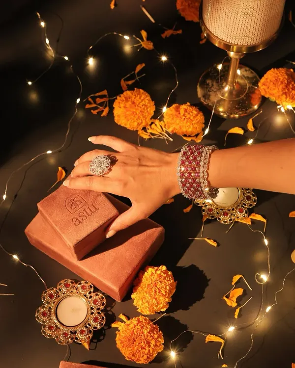 A festive flatlay capturing the spirit of Diwali. My statement rings and bracelets are crafted to make your celebratory moments unforgettable and sparkle as brightly as you do.
