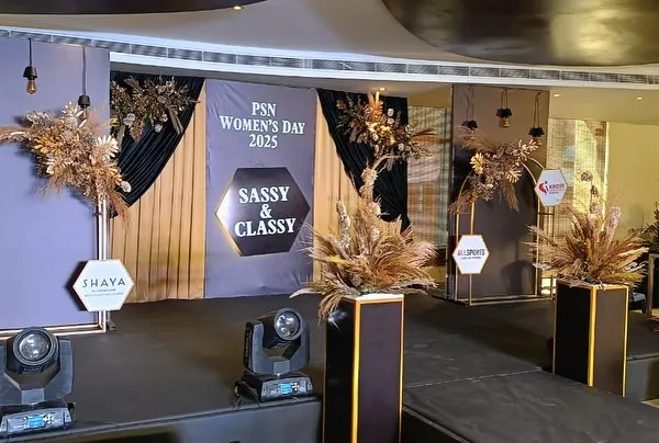 The stage design for the PSN Women's Day 2025 event. We used a modern, layered backdrop with brand logos, boho-chic dried floral arrangements, and spotlights to create a stylish focal point.