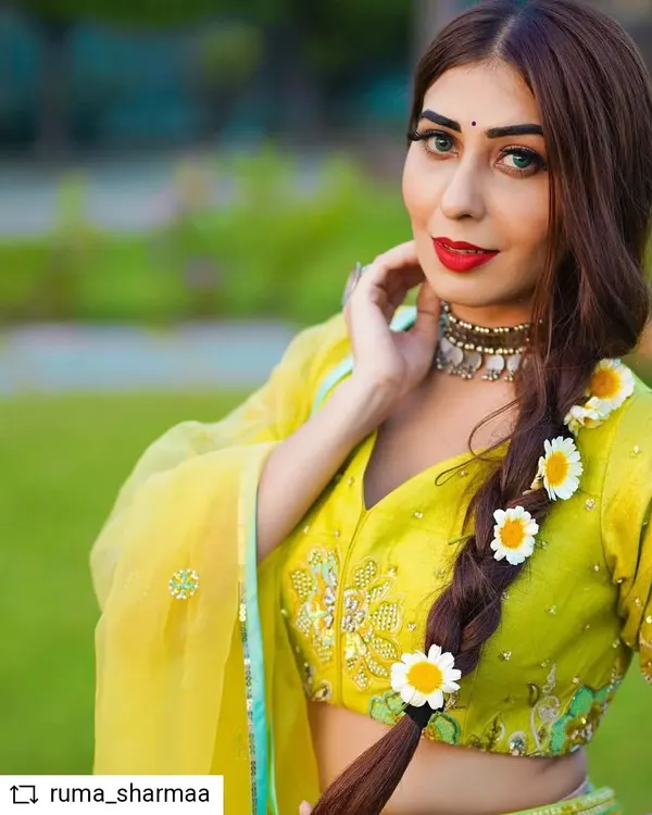 A close-up of the Baisakhi festive look, highlighting the intricate embroidery on the blouse and the modern choker. The styling combines traditional elements with contemporary jewelry for a fresh take on festive wear.