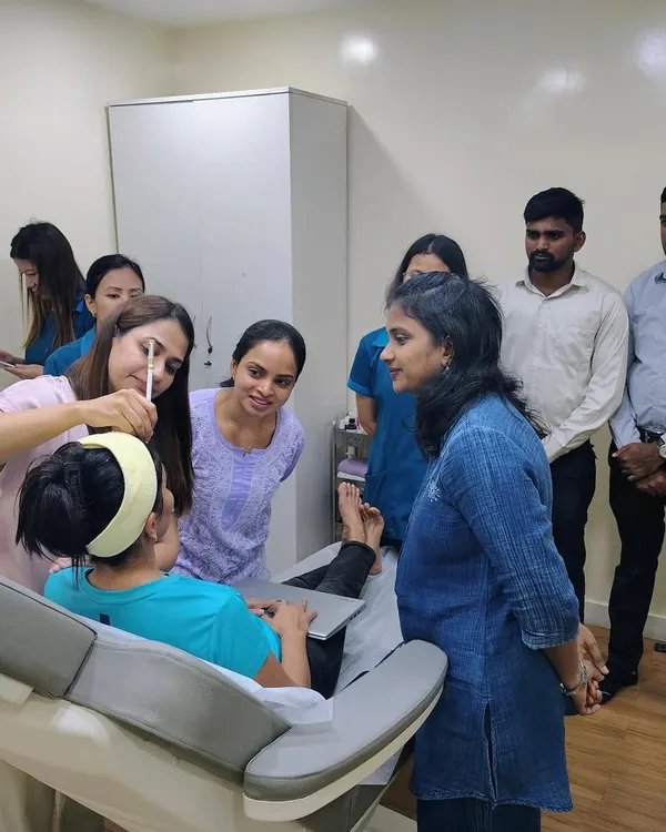 Here, I am demonstrating a precise injection technique during a hands-on botulinum toxin workshop. I believe in close supervision to help fellow dermatologists master the nuances of facial anatomy and achieve safe, natural-looking results for their patients.
