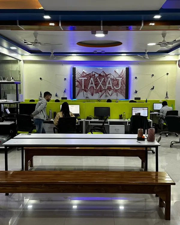 A glimpse into our new workspace where our team collaborates to manage your compliance needs. We've created a modern and energetic environment to foster innovation and deliver the best service to you.