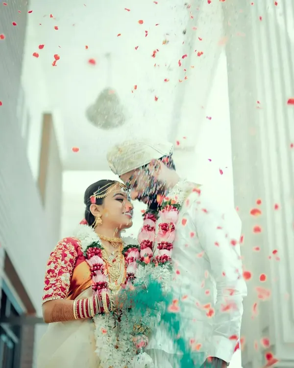 A magical moment just after the vows, showered in petals and love. We focus on capturing these pure, unscripted instances of joy that become your most cherished wedding day memories.