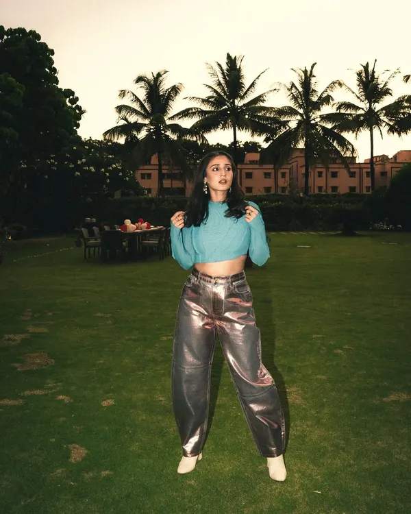 A pop of color for the stage. This custom blue top paired with metallic pink pants for Dhvani is all about creating a fun, high-energy look that shines under the lights.