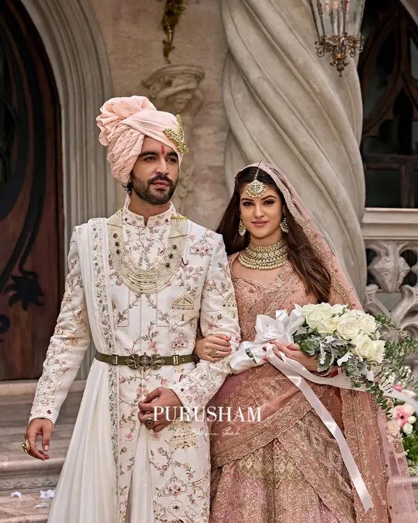 This is the essence of what I strive to create. A moment where love and legacy meet, captured in a custom-designed floral sherwani. The intricate embroidery on the groom's attire is designed to complement the bride's ensemble, creating a harmonious story of modern royalty.