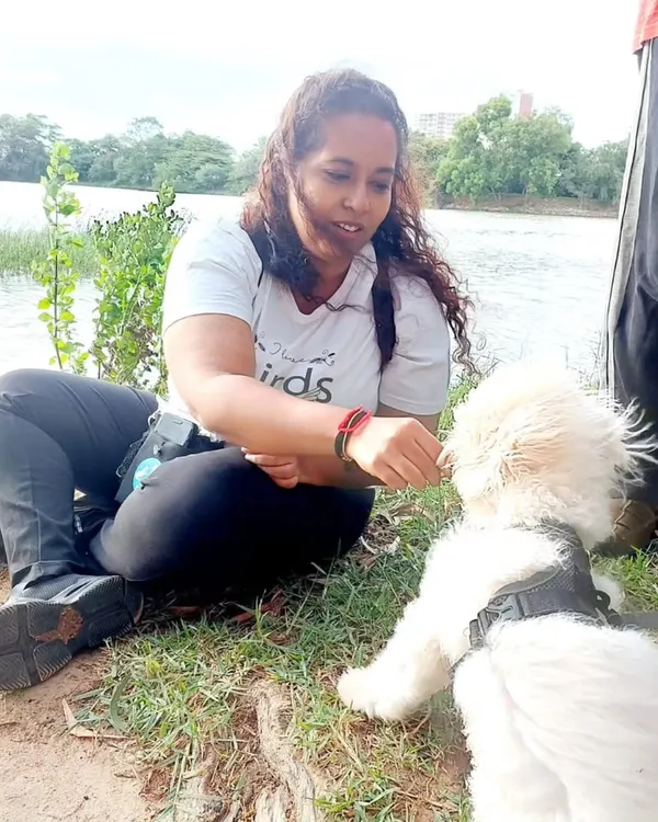 This is me with Ginger during one of our outdoor sessions. He started as a nervous pup who wasn't interested in treats, but through patience and building trust, he learned to love his training sessions.