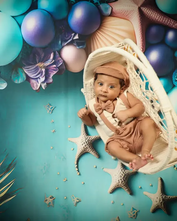 Mr. Handsome is exploring under the sea! This fantasy theme with starfish and bubbles is so creative and makes for a truly unique newborn portrait.