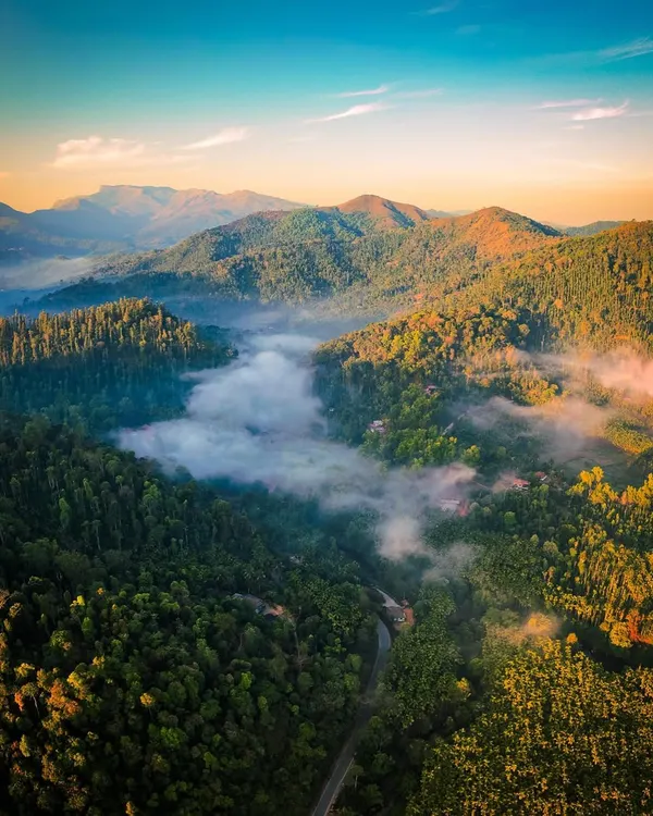 Chasing the morning light in the Western Ghats. This aerial photograph from Kalasa shows the valley filled with a blanket of mist as the first rays of sun touch the surrounding peaks. It’s moments like these, where nature puts on a show, that I live for.