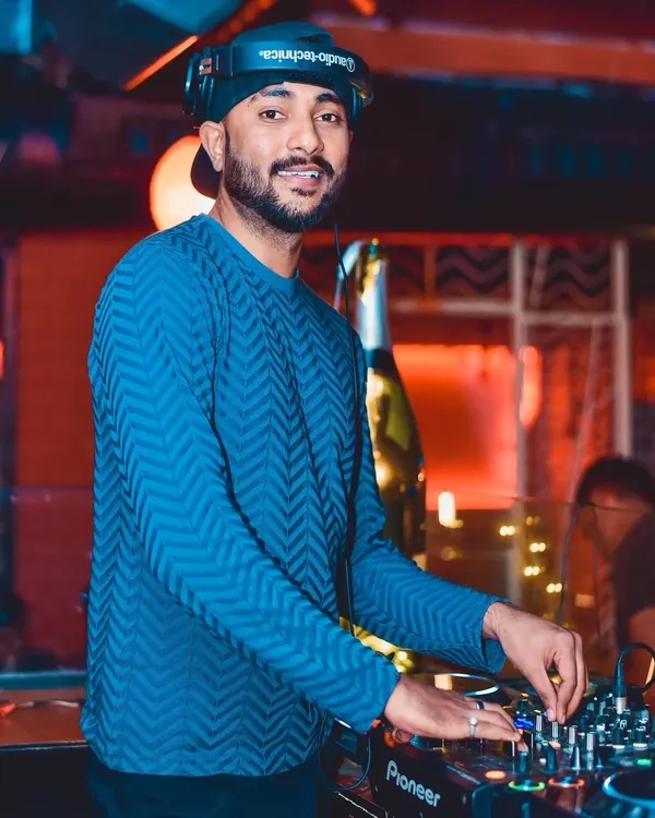 In the zone, mixing tracks under the club lights. This is where I experiment with different genres, blending sounds to create a unique atmosphere. Whether it's deep house or progressive techno, the focus is always on the flow.